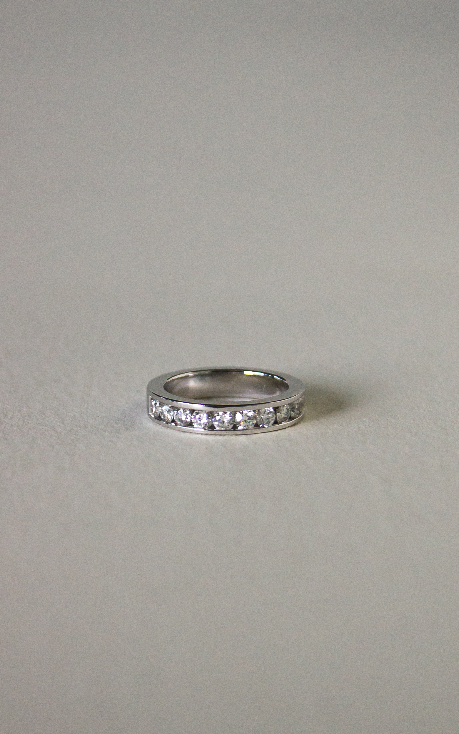 Half-Eternity Diamond Ring crafted in 18K white gold, featuring 13 round brilliant-cut channel-set diamonds with a total weight of 1.26 carat.